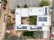 Aerial view of home with large solar panel system, lush landscaping, and courtyard at 3910 W Pebble Rd, Las Vegas, NV 89139