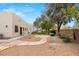 Landscaped backyard featuring desert landscaping, mature trees and shrubs, gravel, and stone walkways at 3910 W Pebble Rd, Las Vegas, NV 89139