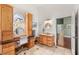 Bathroom with custom wood cabinetry, dual sinks, and tile flooring at 3910 W Pebble Rd, Las Vegas, NV 89139