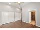 This bedroom offers wood floors, closet space, and an ensuite bathroom with walk-in shower at 3910 W Pebble Rd, Las Vegas, NV 89139