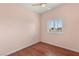 Bedroom with hardwood floors, updated lighting and natural light at 3910 W Pebble Rd, Las Vegas, NV 89139
