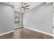 Bright bedroom featuring wood floors, natural light, and neutral walls, perfect for relaxation at 3910 W Pebble Rd, Las Vegas, NV 89139