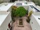 A view of a courtyard with a water feature and plants within a light-colored single-story house at 3910 W Pebble Rd, Las Vegas, NV 89139