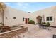 Inviting courtyard features a fountain, outdoor seating, and stucco walls for private relaxation at 3910 W Pebble Rd, Las Vegas, NV 89139