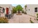 Spacious outdoor courtyard with a decorative fountain, seating area and beautiful greenery at 3910 W Pebble Rd, Las Vegas, NV 89139