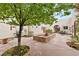 Beautiful courtyard featuring a decorative fountain, lush landscaping and trees for shade at 3910 W Pebble Rd, Las Vegas, NV 89139