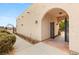 Inviting entrance to the home with a beautiful arched doorway leading to an inner courtyard at 3910 W Pebble Rd, Las Vegas, NV 89139