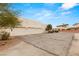 View of the three car garage and driveway at 3910 W Pebble Rd, Las Vegas, NV 89139