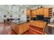 Spacious kitchen featuring wood cabinets, granite countertops, and stainless steel appliances at 3910 W Pebble Rd, Las Vegas, NV 89139