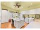 Spacious laundry room equipped with washer, dryer, storage cabinets, and central island at 3910 W Pebble Rd, Las Vegas, NV 89139