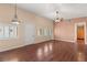 Spacious living room with hardwood floors, large windows and modern lighting at 3910 W Pebble Rd, Las Vegas, NV 89139