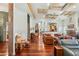 Spacious living room with wood floors, beamed ceilings, and comfortable seating arrangement at 3910 W Pebble Rd, Las Vegas, NV 89139
