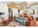 Bright living room with wood floors, comfortable seating, and view of kitchen area at 3910 W Pebble Rd, Las Vegas, NV 89139