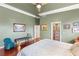 Beautiful main bedroom with hardwood floors, crown molding, and elegant furnishings at 3910 W Pebble Rd, Las Vegas, NV 89139