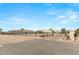 Street view featuring the property's fencing, gate, and desert landscaping, showcasing its curb appeal at 3910 W Pebble Rd, Las Vegas, NV 89139