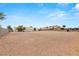 Large, vacant lot ready for construction with trees and a glimpse of other homes at 3910 W Pebble Rd, Las Vegas, NV 89139
