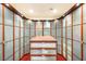 Large walk-in closet with custom shelving, drawers, and frosted glass doors at 3910 W Pebble Rd, Las Vegas, NV 89139