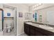 Well-lit bathroom with double vanity, granite countertops, and modern fixtures at 4352 Browns Creek Ave, North Las Vegas, NV 89084