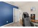 A brightly painted, cheerful bedroom with multiple doors and openings to other rooms at 4352 Browns Creek Ave, North Las Vegas, NV 89084