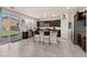 An airy kitchen featuring an island with bar stools, sliding glass doors and stainless steel appliances at 4352 Browns Creek Ave, North Las Vegas, NV 89084