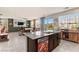 Bright and airy living room featuring an island, built-in shelves, and sliding glass doors to backyard at 4352 Browns Creek Ave, North Las Vegas, NV 89084