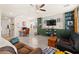 Spacious living room with tile floors, built-in shelving, ceiling fan, and a cozy atmosphere at 4352 Browns Creek Ave, North Las Vegas, NV 89084