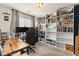Functional home office with custom white shelving, cozy gray carpet, and ample natural light at 4352 Browns Creek Ave, North Las Vegas, NV 89084