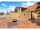 Landscaped backyard featuring a fire pit and tiled patio at 4360 Flandes St, Las Vegas, NV 89121