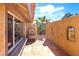 Charming outdoor patio with a decorative fountain and landscaped garden at 4360 Flandes St, Las Vegas, NV 89121