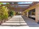 Spacious covered patio with greenery, providing shade and tranquility for outdoor gatherings at 4360 Flandes St, Las Vegas, NV 89121