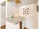 A convenient wet bar with stone counters, a sink, and stylish glass storage at 4360 Flandes St, Las Vegas, NV 89121