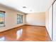 Spacious bedroom with hardwood floors and natural light from the windows at 4360 Flandes St, Las Vegas, NV 89121
