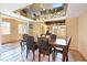 Dining room featuring a mirrored ceiling, terracotta tile, and natural light at 4360 Flandes St, Las Vegas, NV 89121