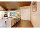 Hallway featuring a wooden ceiling, tiled floor, and a modern and comfortable interior at 4360 Flandes St, Las Vegas, NV 89121
