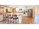 Open concept kitchen featuring bar seating, stainless steel appliances, and granite countertops at 4360 Flandes St, Las Vegas, NV 89121