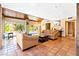 Living room with brick columns, terracotta tile flooring, and access to the patio at 4360 Flandes St, Las Vegas, NV 89121