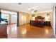 Spacious main bedroom with hardwood floors, ceiling fan, and ensuite bath at 4360 Flandes St, Las Vegas, NV 89121