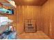 Well-organized pantry with wooden walls, shelving, and a wine rack for convenient storage solutions at 4360 Flandes St, Las Vegas, NV 89121
