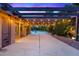 Spacious covered patio with string lights, perfect for outdoor dining and entertaining at 4360 Flandes St, Las Vegas, NV 89121
