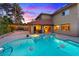 View of the pool, patio, and home exterior, ideal for enjoying indoor-outdoor living at 4360 Flandes St, Las Vegas, NV 89121