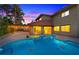 Backyard pool area with outdoor lighting, perfect for evening swims and gatherings at 4360 Flandes St, Las Vegas, NV 89121