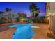 Sparkling swimming pool with lush landscaping, providing a serene backyard oasis at 4360 Flandes St, Las Vegas, NV 89121