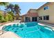 Inviting backyard pool with a slide, perfect for summer relaxation and entertainment at 4360 Flandes St, Las Vegas, NV 89121