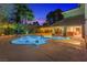 Backyard pool with landscaping, patio, and sliding glass doors leading inside at 4360 Flandes St, Las Vegas, NV 89121