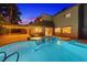Back of home featuring a large, well-maintained pool and patio area with home visible at 4360 Flandes St, Las Vegas, NV 89121
