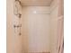 Shower featuring vertical tile and wall mounted caddy at 4360 Flandes St, Las Vegas, NV 89121