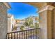 Balcony view of street and nearby townhomes with a beautiful blue sky at 4516 Townwall St, Las Vegas, NV 89115