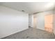 Bright bedroom featuring neutral carpet and an en-suite bathroom at 4516 Townwall St, Las Vegas, NV 89115
