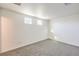 Bedroom with neutral carpet, white walls, and dual windows for natural light at 4516 Townwall St, Las Vegas, NV 89115