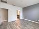 Primary bedroom with ensuite bathroom, neutral walls, and stylish flooring at 4516 Townwall St, Las Vegas, NV 89115